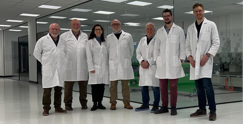 The Allotrope Energy team in lab coats in the Basingstoke laboratory